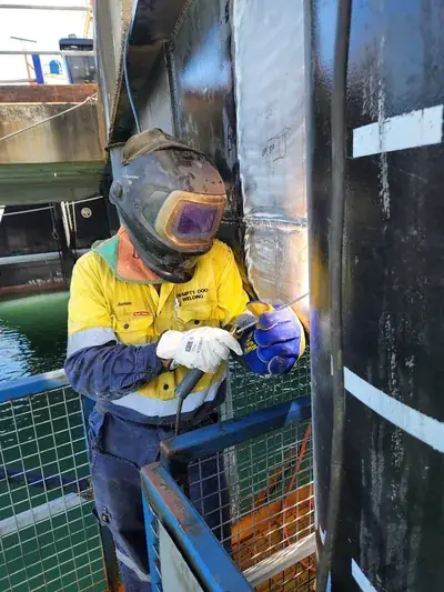 Marine pile welder confined cage waterfront