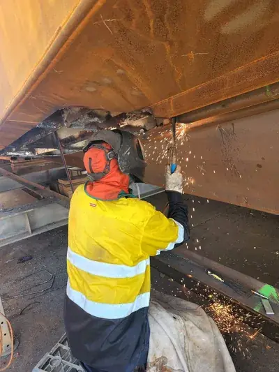 Boat hull underside panel weld repair