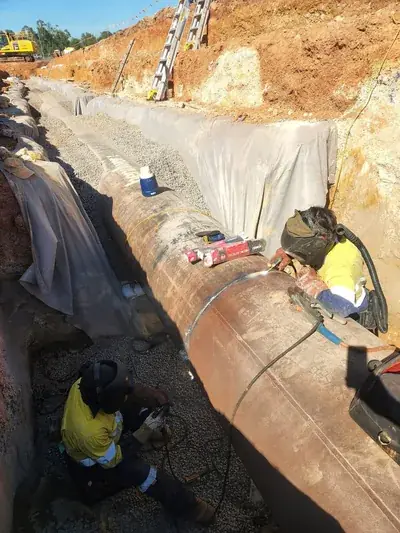 Coded pipe welding team trench
