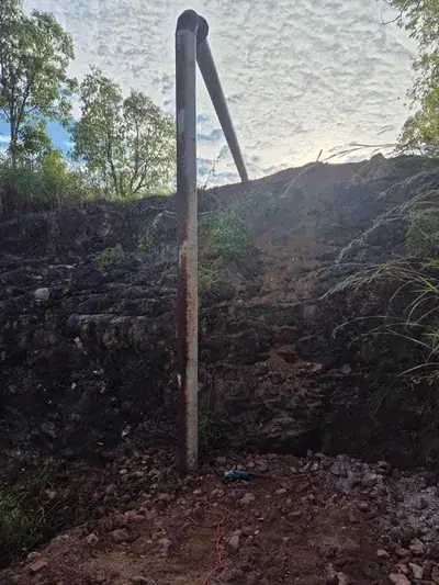 Steel pipe install rock cutting hillside