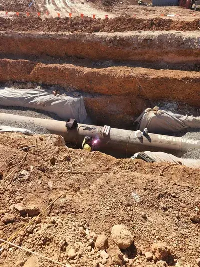 Underground pipe join welding trench